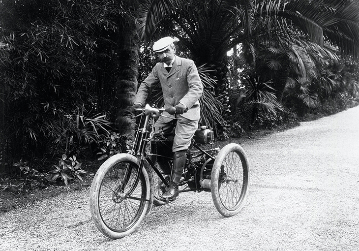 Baron Pierre de Coubertin, photographed on a motor tricycle in the south of France.