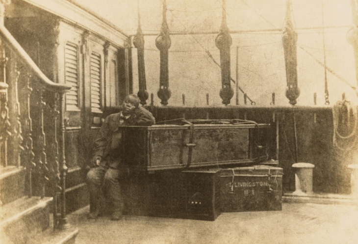 Jacob Wainwright with David Livingstone's body and some of his traveling trunks on board the ship Malwai.