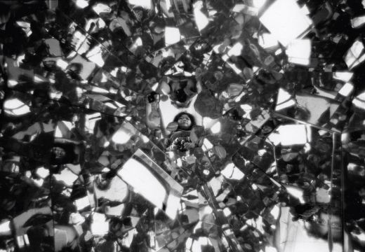 Photograph of Shigeko Kubota reflected in Three Mountains (1976–79) in her loft on Mercer Street, New York (1979), Peter Moore.