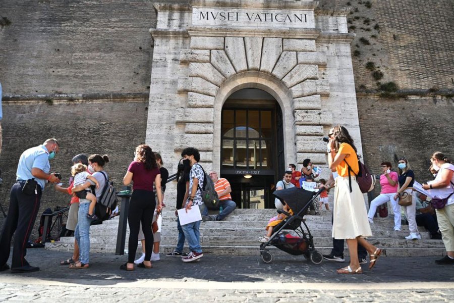 Visitors showing their ‘green pass’ at the Vatican Museums in August 2021.