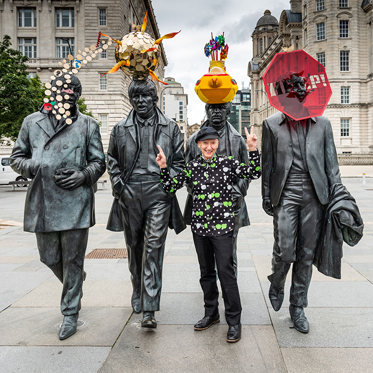 Milliner Stephen Jones with the hats he designed for Andy Edwards’ Beatles statue, Pier Head, Liverpool.