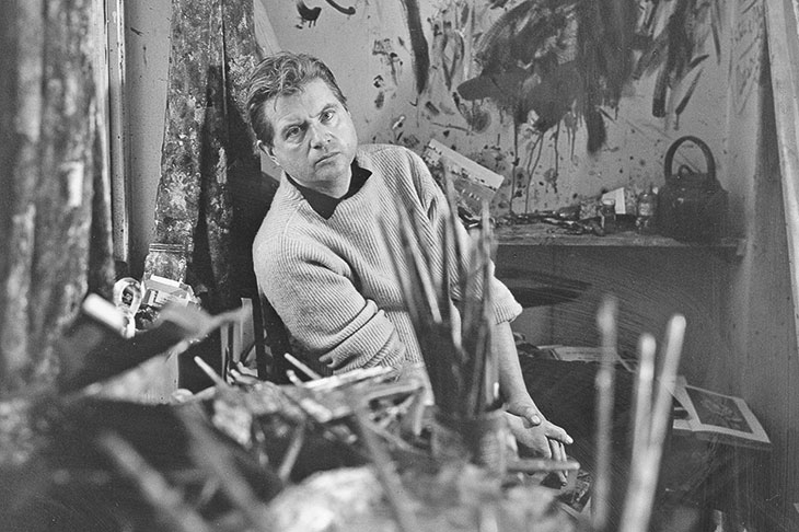Francis Bacon photographed by Cecil Beaton in 1960 in his studio at Overstrand Mansions in Battersea, London.