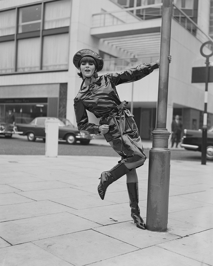 Model Jackie Bowyer wearing a black oilskin wet-weather outfit from Mary Quant, London, October 1963. Photo: Central Press/Hulton Archive/Getty Images