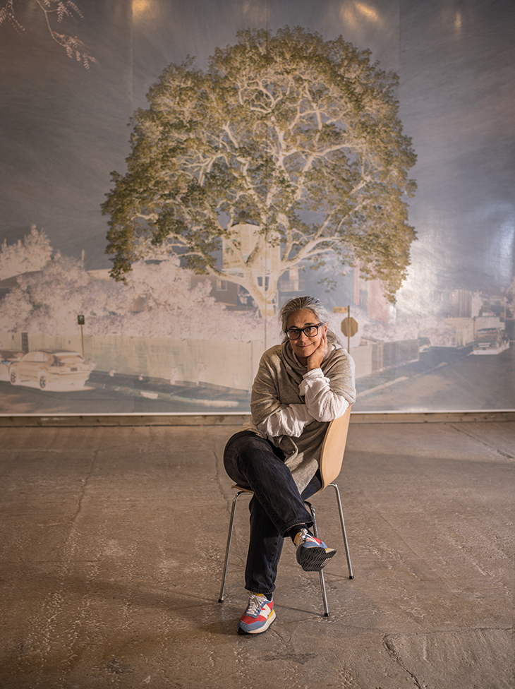 Tacita Dean, photographed in Frith Street Gallery’s Golden Square space in London, in October 2021. Behind her is one of the works in the Purgatory (2021) series.