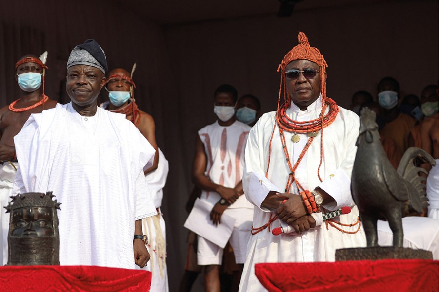 Oba Ewuare II (right), receiving restituted Benin Bronzes from Aberdeen and Cambridge universities in a ceremony in February 2022.