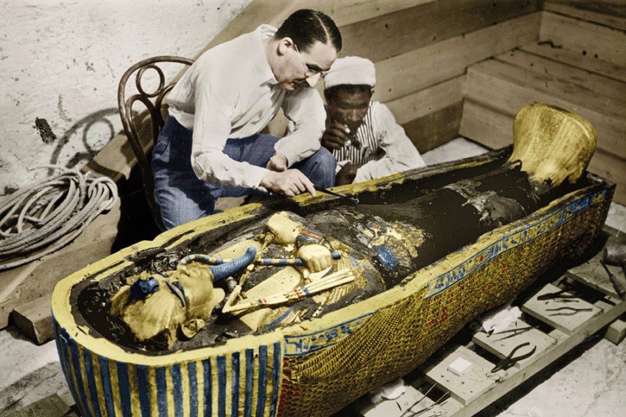 Howard Carter photographed with the golden sarcophagus of Tutankhamun in 1922 by Harry Burton (colourised version).