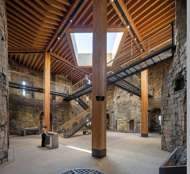 The tower’s new walkways and timber roof/deck with a central void left open to the elements.