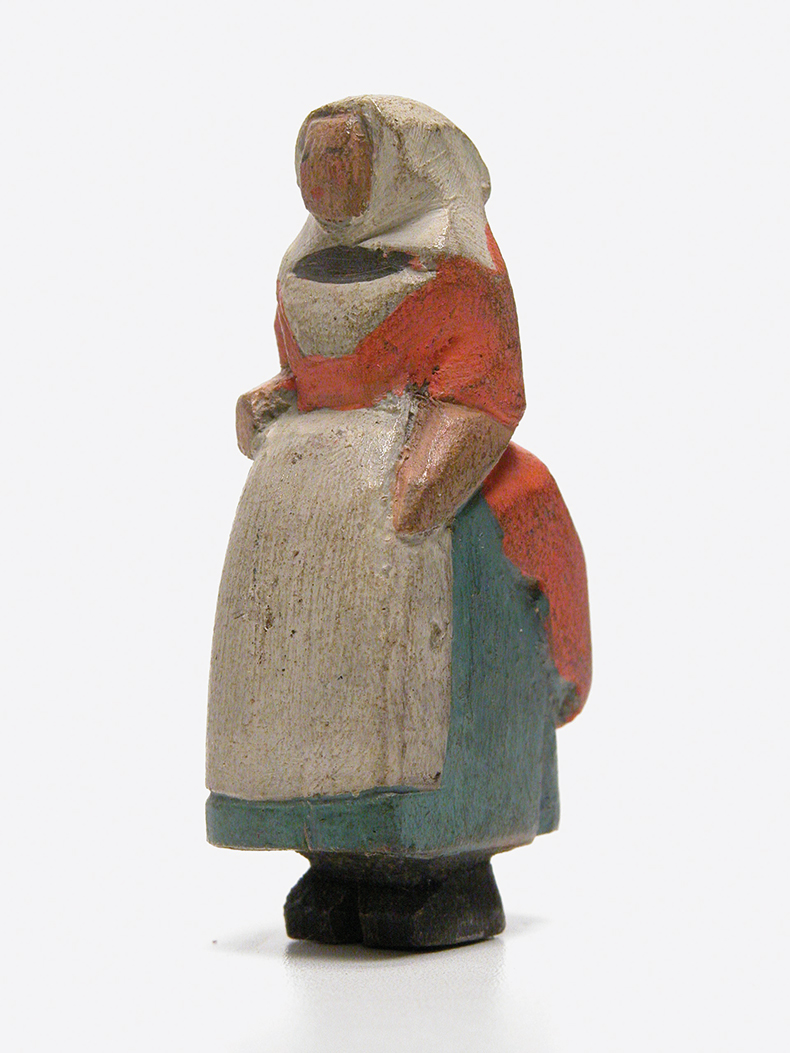 Figure of a lady wearing Victorian dress, made by Charles Paget Wade.
