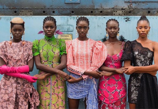 Models hold hands during Lagos Fashion Week. Courtesy Lagos Fashion Week; photo: Stephen Tayo