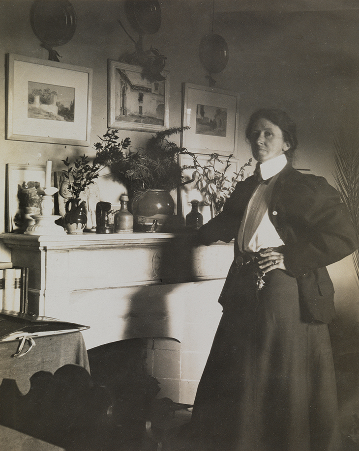 Vernon Lee photographed in 1902 by Ernestine Fabbri in her study at Villa Il Palmerino in Florence.
