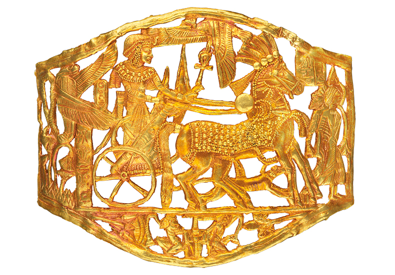 Openwork gold plaque depicting a victorious Tutankhamun in a chariot, from the tomb of Tutankhamun