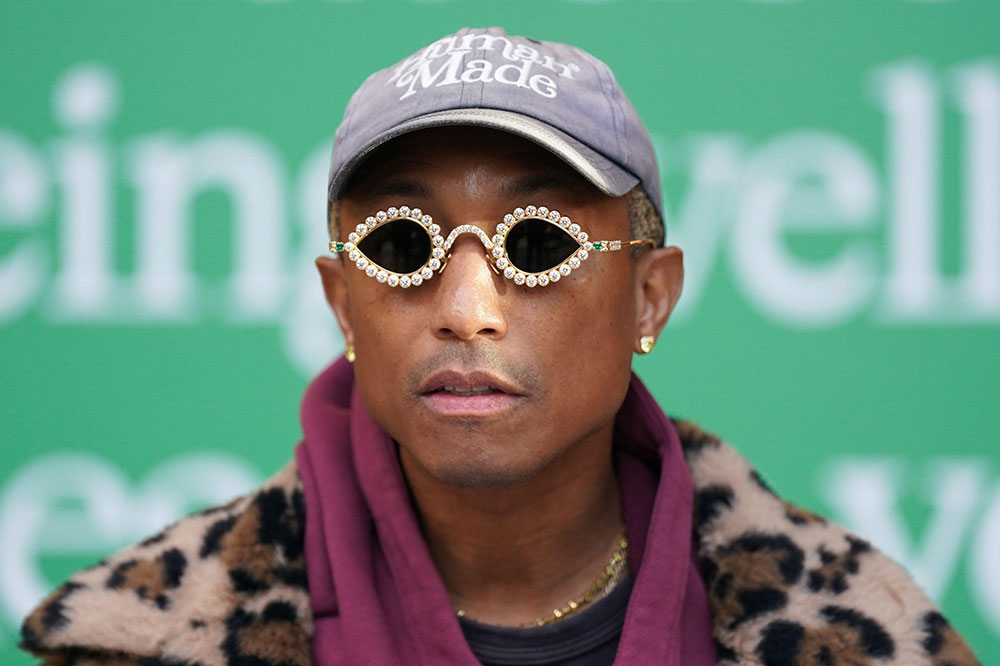 Pharrell Williams in Chanel and Adidas During Paris Fashion Week