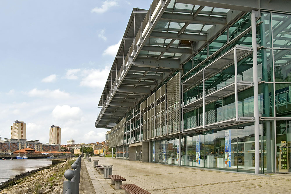 Facade of glass building on riverside