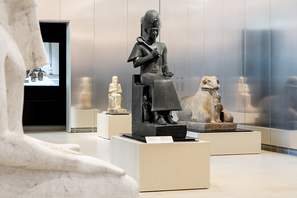 Ancient Egyptian artifacts displayed attractively in one of the galleries of the Egyptian Museum in Turin.
